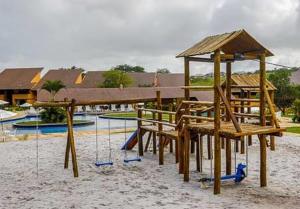 a park with a playground with a swing at Flat 419 - Winterville-Gravatá in Gravatá +16 photos