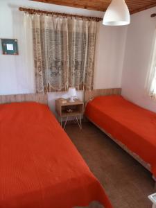 Łóżko lub łóżka w pokoju w obiekcie Villa Niki
