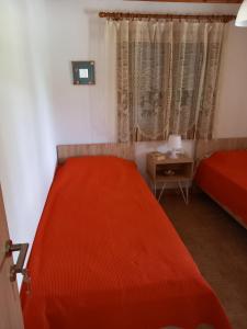 Łóżko lub łóżka w pokoju w obiekcie Villa Niki