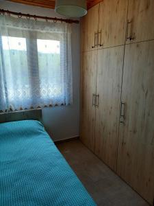 Łóżko lub łóżka w pokoju w obiekcie Villa Niki