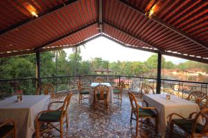 A restaurant or other place to eat at Konkan Crown Resort & Club