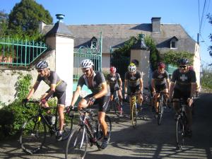 a group of people riding bikes down a road at Mountain retreat in the Pyrénées, glorious views, fire pit & pool - Sleeps 14 in Ossun-ez-Angles