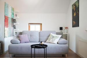 a living room with a couch and a table at Fado Apartments Gornja Radgona in Gornja Radgona