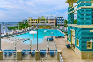 a view of a swimming pool at a resort at Sunset Island - 3 Canal Side Mews in Ocean City