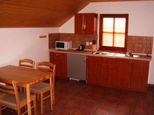 Kuchyň nebo kuchyňský kout v ubytování Apartmán Pohoda