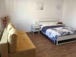 Postel nebo postele na pokoji v ubytování Apartment CHEZ TONY