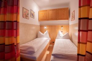 Posteľ alebo postele v izbe v ubytovaní Kaprun Apartments