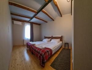 a bedroom with a large bed in a room at Chateau Gremisio in Kvareli +27 photos