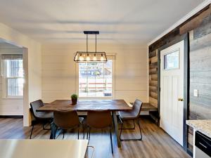 a dining room with a table and chairs and a window at Manzanita Holiday 1 in South Lake Tahoe