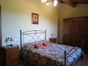 Giường trong phòng chung tại Agriturismo Collesassi