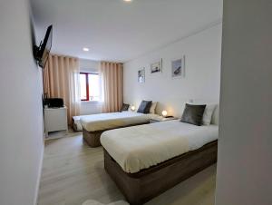 Ένα ή περισσότερα κρεβάτια σε δωμάτιο στο Silvaapartments +74 φωτογραφίες