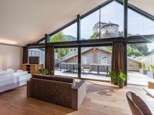 A bed or beds in a room at Platzhirsch Kufstein