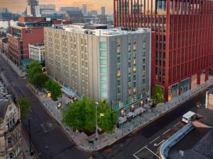 an aerial view of a large building in a city at YOTEL Manchester Deansgate in Manchester