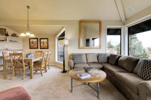 a living room with a couch and a table at River Ridge 420AB in Bend