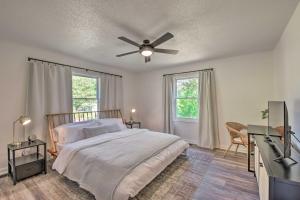 a bedroom with a bed and a ceiling fan at Lakefront Townville Gem with Boat Dock and Kayaks in Townville