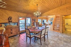 a dining room with a table and chairs at Beachfront Lake Michigan Log Cabin with Sauna! in Rapid River