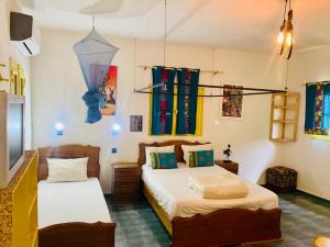 Un ou plusieurs lits dans un hébergement de l'établissement Hotel Mimosa Airport