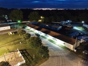 an overhead view of a factory at night at Four Oaks Lodging in Smithfield