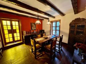a dining room with a table and chairs at Inka Tambo Hacienda in Cusco