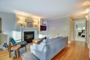 a living room with a couch and a fireplace at "The Fremont Lookout" with Deck & Gourmet Kitchen! apts in Seattle