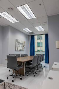 a conference room with a wooden table and chairs at Luxury 1BD Apt in Downtown Brickell free parking in Miami