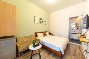 Postel nebo postele na pokoji v ubytování Jinguann B&B