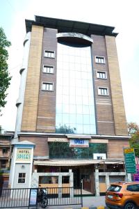 a large building with a large window on it at Hotel Spices Navi Mumbai in Ghansoli