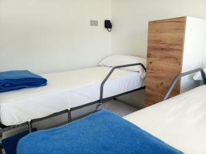 Postel nebo postele na pokoji v ubytování Albergue La Huella