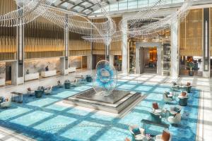 an overhead view of a lobby with a fountain at Taj Exotica Resort & Spa, The Palm, Dubai in Dubai