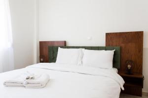 Postel nebo postele na pokoji v ubytování Suggrou Apartment