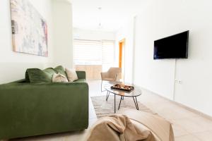 TV a/nebo společenská místnost v ubytování Suggrou Apartment