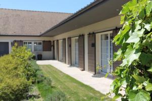 a house with a walkway in front of it at Le Clos 24 in Macherin