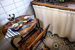 a table with a plate of food on it in a kitchen at Giamevi House in Vignanello +12 photos
