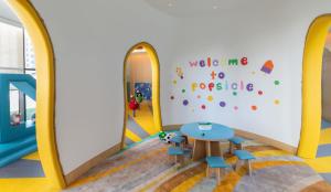 a childrens play area with a table and chairs at Taj Exotica Resort & Spa, The Palm, Dubai in Dubai
