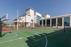 a basketball court in front of a building at Taj Exotica Resort & Spa, The Palm, Dubai in Dubai