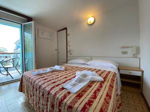 Posteľ alebo postele v izbe v ubytovaní Hotel Nanni Garnì