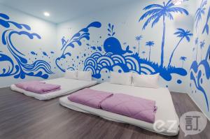 Ένα ή περισσότερα κρεβάτια σε δωμάτιο στο Mu Yu B&B