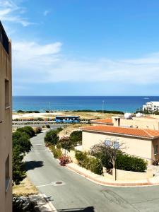 a view of the ocean from a building at Direct Sea View & Quality Bed - Kings Palace 1 bed in Paphos City