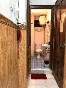 a small bathroom with a toilet and a sink at North Hostel N.2 in Hanoi