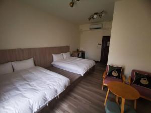 Ένα ή περισσότερα κρεβάτια σε δωμάτιο στο 360 Coffee Homestay