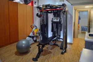 a gym with a black chair in a room at Mpoulakis Apt 46 in Kissamos
