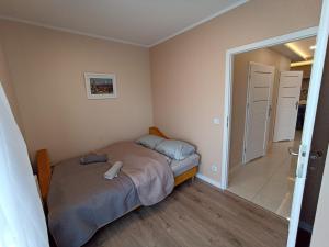 Posteľ alebo postele v izbe v ubytovaní APARTAMENTY BARSKA 69