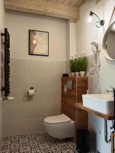 Kúpeľňa v ubytovaní Apartamenty Równia 2 + 37 fotografií