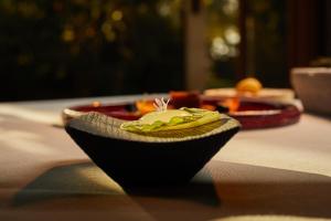 a bowl of food sitting on a table at Fontsanta Hotel Thermal & Spa - Adults Only in Colònia de Sant Jordi