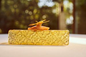 a gold box with a figurine on top of it at Fontsanta Hotel Thermal & Spa - Adults Only in Colònia de Sant Jordi