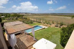 an overhead view of a backyard with a swimming pool at Fontsanta Hotel Thermal & Spa - Adults Only in Colònia de Sant Jordi