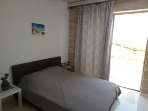 En eller flere senge i et værelse på Villa Stylianos retreat