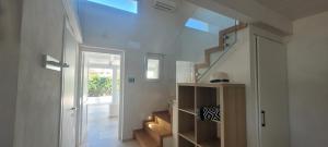 a room with a staircase with a skylight at Villaggio Camping Oasi in Vieste