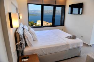 Postelja oz. postelje v sobi nastanitve Ionian Stone Luxury Villa