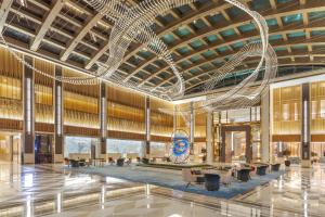 a rendering of a large lobby with a large chandelier at Taj Exotica Resort & Spa, The Palm, Dubai in Dubai
